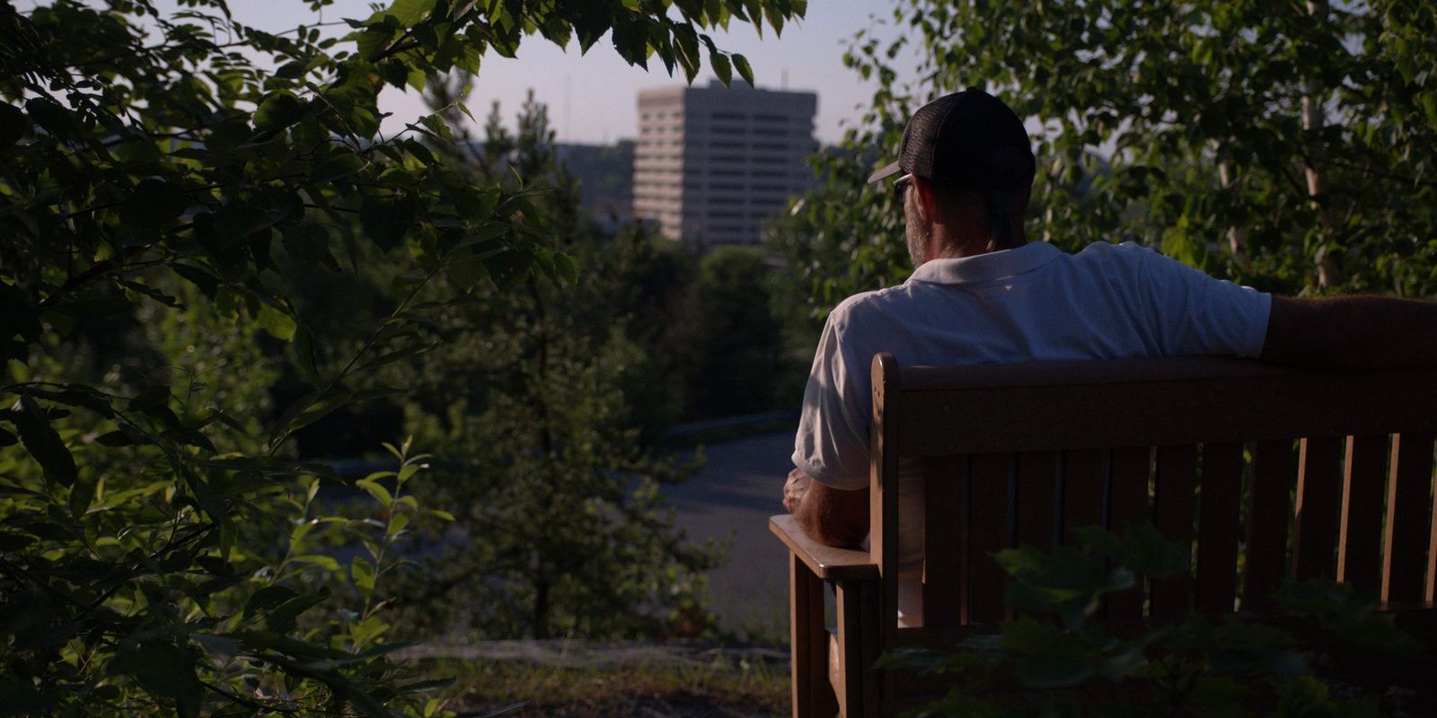 Derek Young taking in the view of Sudbury from a park bench