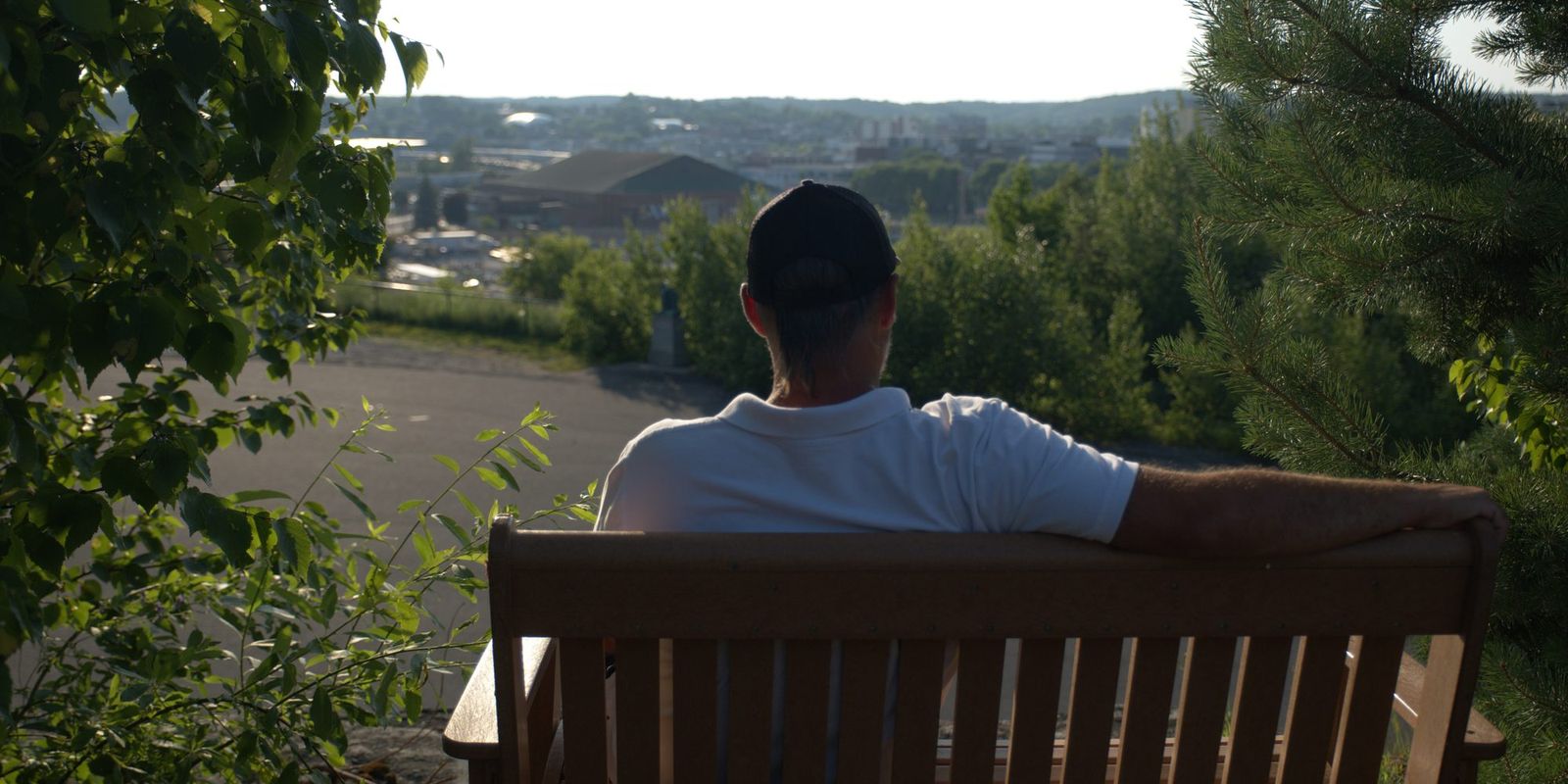 Derek Young on a bench overlooking Sudbury
